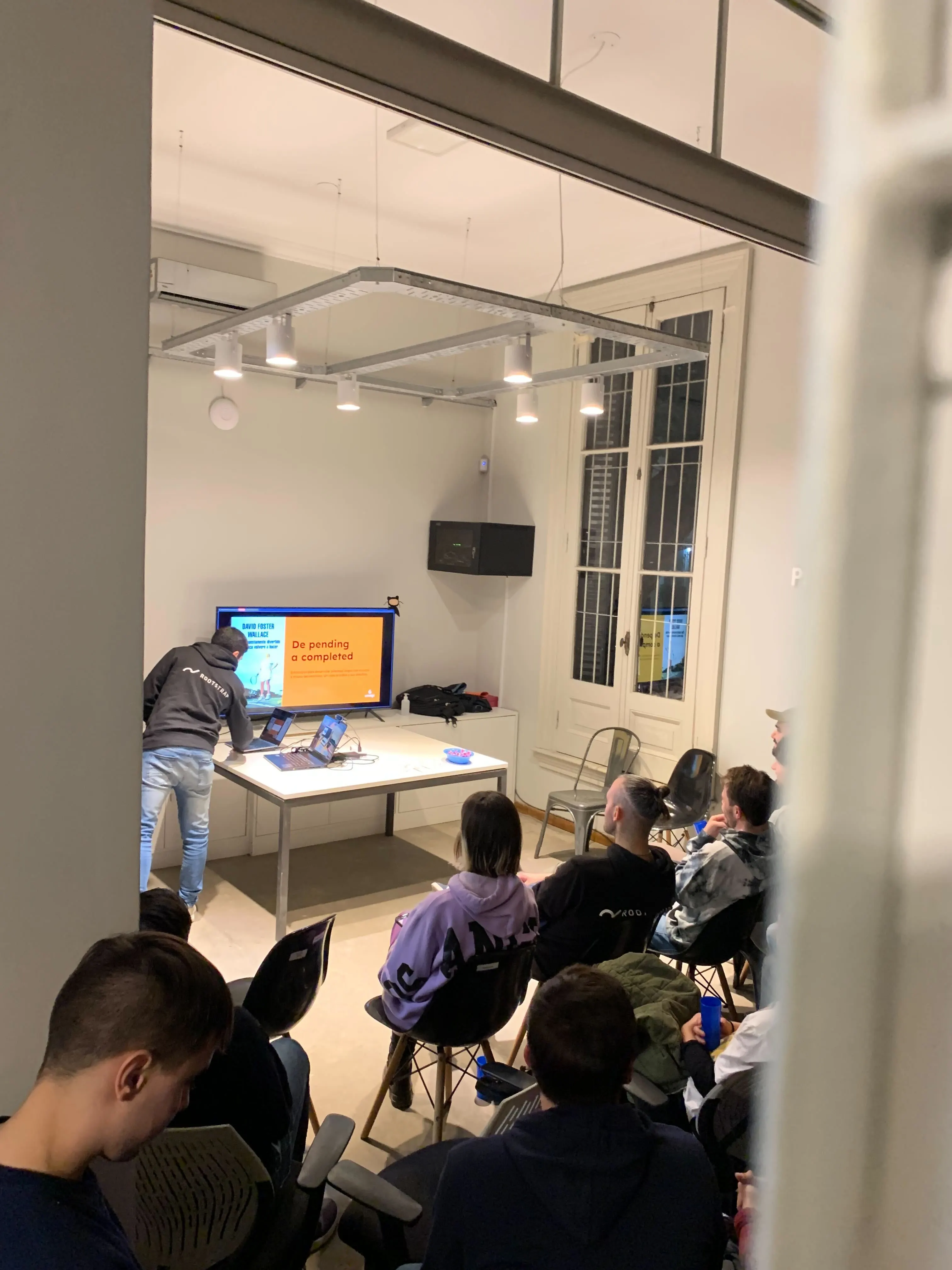 Bruno showing the first slide of his talk and the audience attentively listening